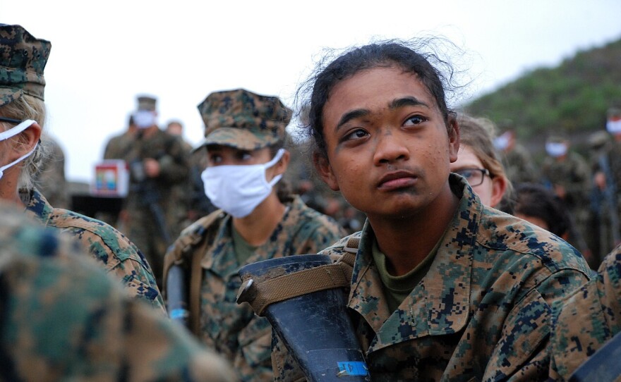 Poway native Pvt. AnneMargret Frazier resting with her platoon after completing the Crucible challenge, April 22, 2021.