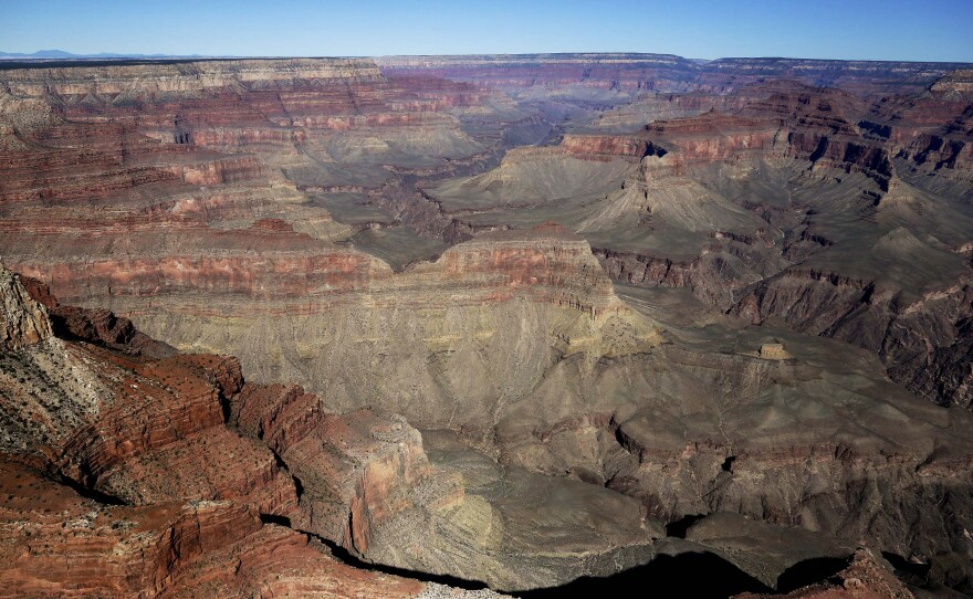 A sight-seeing helicopter carrying seven went down in the Grand Canyon Saturday, killing four people and critically injuring the others.