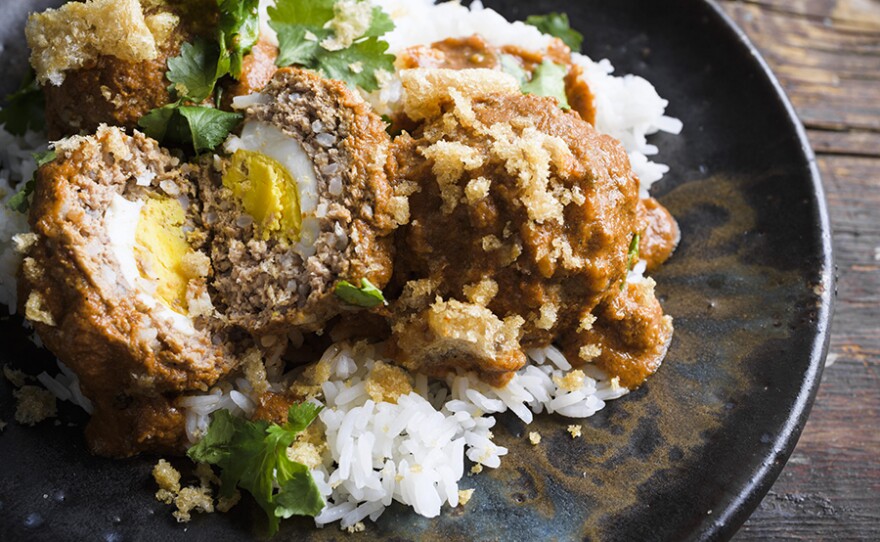 Egg-Stuffed Mexican Meatballs with Salsa Roja in a flavorful chipotle sauce.