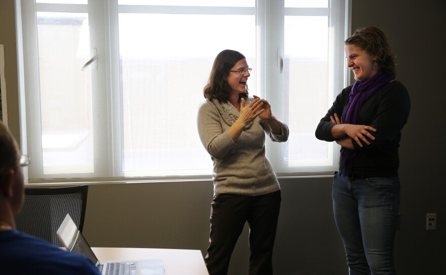 Solomon gives a student advice on a lab presentation.