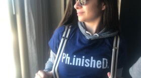 In this photo taken February, 2019, Sophia Hirakis celebrates the successful defense of her doctoral degree at UC San Diego with a witty t-shirt her parents bought her.