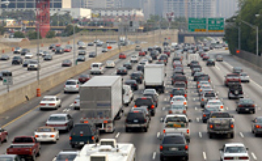 A file photo shows traffic crawling through downtown Atlanta, Ga., along Interstate 75/85 during rush hour.