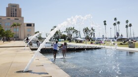 Two girls play in the water at Waterfront Park, August 18, 2016. 