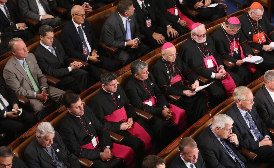 Catholic clergy sit among members of Congress as Pope Francis addressed a joint meeting of Congress Thursday.