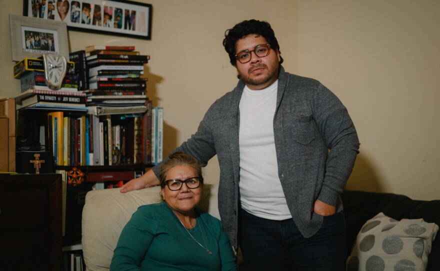Joshua Lopez, right, stands for a portrait with his mother, Rosa Perez, at their home at the Hawaiian Gardens apartments in Imperial Beach, California on November 18, 2024. Lopez is one of dozens of tenants facing eviction and is urging the City Council to pass new local protections for renters.