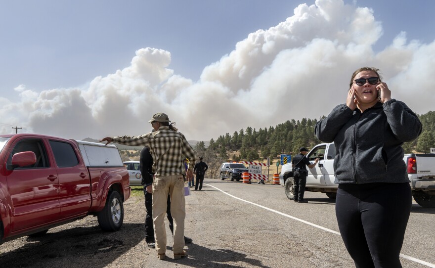 Kylee Moberg tries to get through a road block on N.M. 94 to get to her friend and horses on Friday. Destructive Southwest fires have burned dozens of homes in northern Arizona and put numerous small villages in New Mexico in the path of danger.