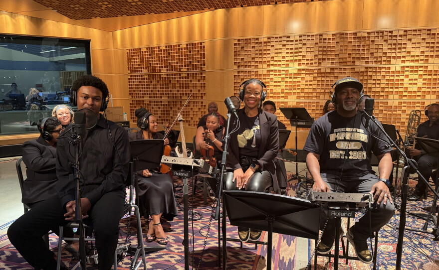 Kaleb Cabell, Andrea Coln McNeill and Jeffrey McNeill perform as part of The Illharmonic Orchestra at NPR's Washington headquarters.