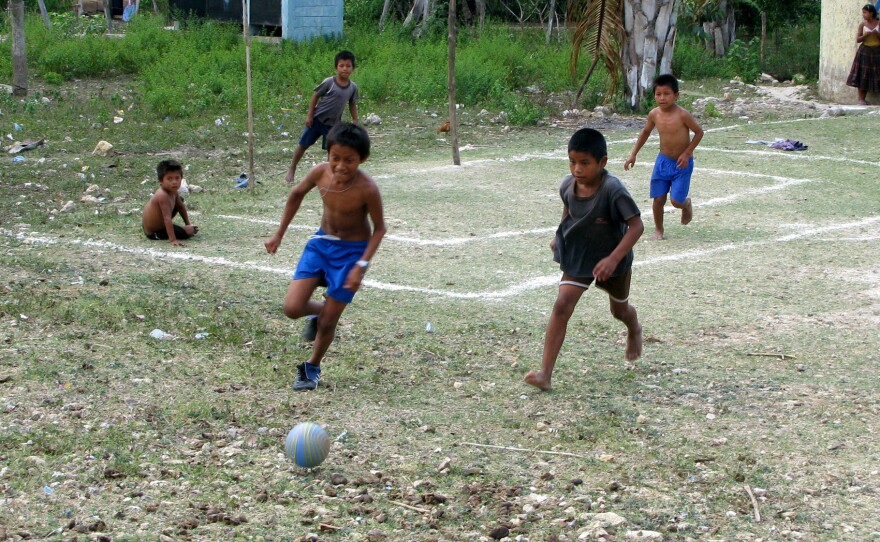 Children play soccer in the village of Limon in the Peten region of northern Guatemala.