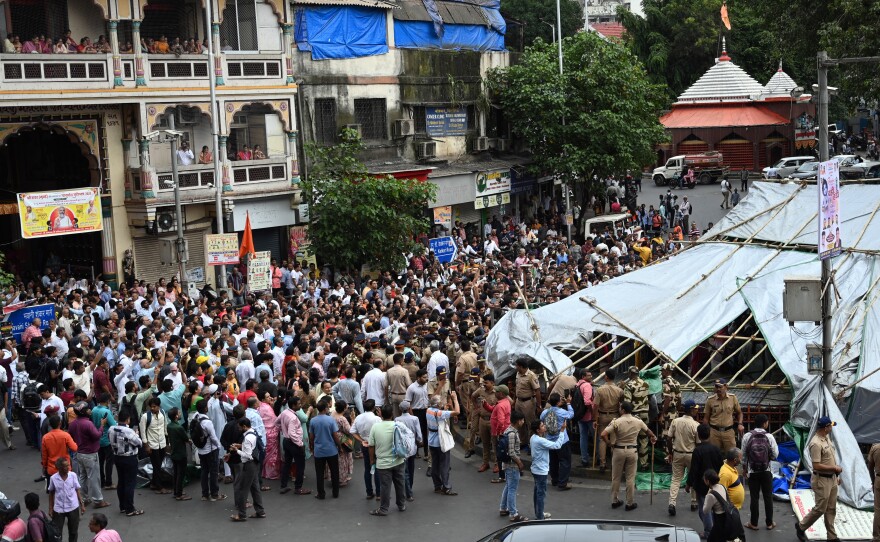 After a court-ordered ban on feeding pigeons at Mumbai's designated pigeon-feeding spots, pro-pigeon protesters gathered, including members of the city's Jain community.
