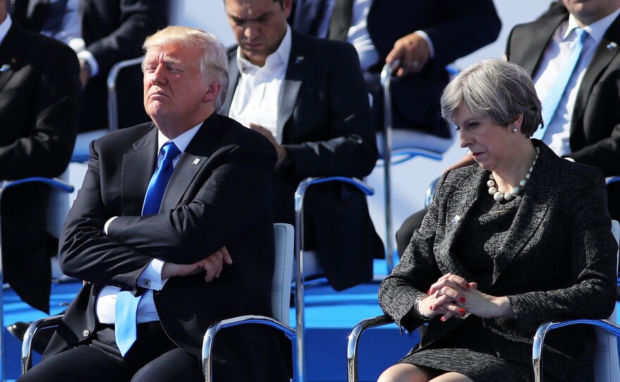 President Donald Trump and British Prime Minister Theresa May await a photo opportunity at a NATO summit meeting in Brussels on Thursday.