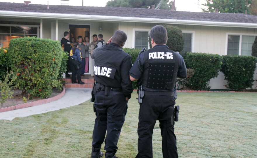 President Donald Trump's executive order on immigration broadened the category of immigrants who the government considers a priority for deportation. In this file photo, immigration agents conduct an arrest in Southern California.