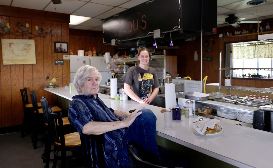 Jim Cavner, left, with Jessica Wells, a waitress at Lou's Diner, in Perry, Iowa, on Nov. 8, 2023.