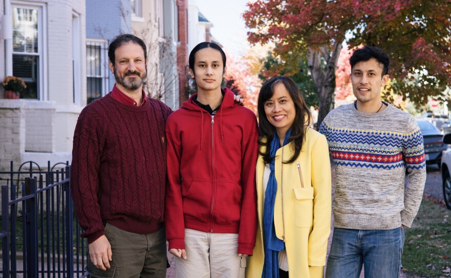 David Roodman and Mai Pham at their Washington, D.C., home with their sons, Alex Roodman (left) and Ben Pham Roodman.