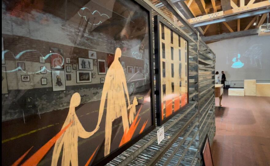 An artwork at Bread and Salt Gallery depicts a Ukrainian family fleeing from war, June 15 2022.