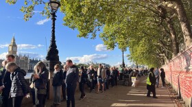 This portion of the line ran between the National COVID Memorial Wall and the Thames River, with a view of the Houses of Parliament on the other side.