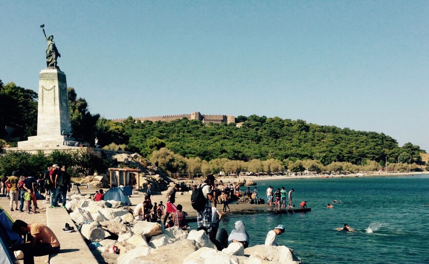 Syrians, Iraqis and others swim and wash in the warm Aegean waters off Mytilene on the Greek island of Lesbos, trying to forget the treacherous crossing they just made.