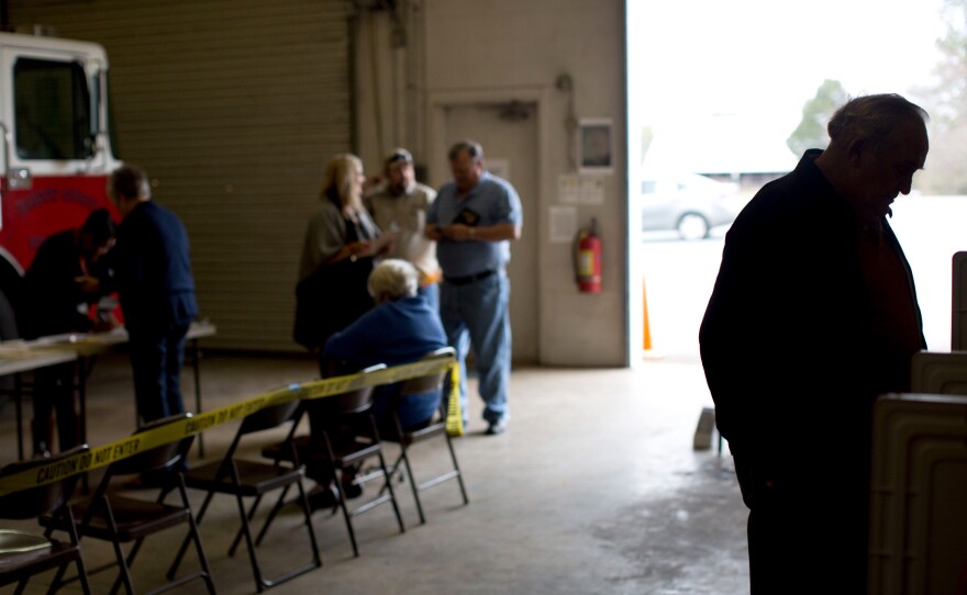 A Georgia voter casts his ballot at a fire station in Adairsville, Ga.