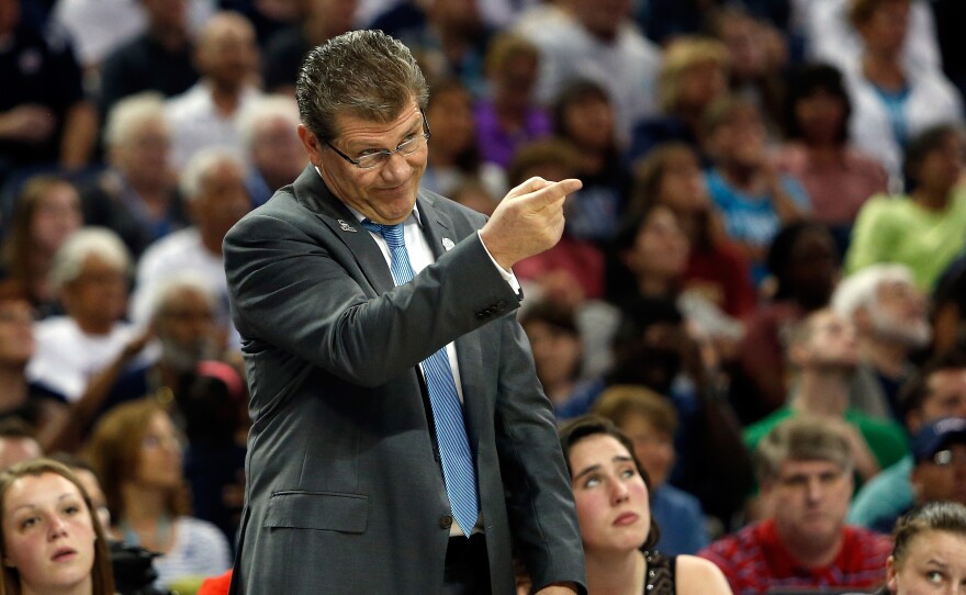 Head coach Geno Auriemma of the Connecticut Huskies calls to his players in the first half against the Notre Dame Fighting Irish.