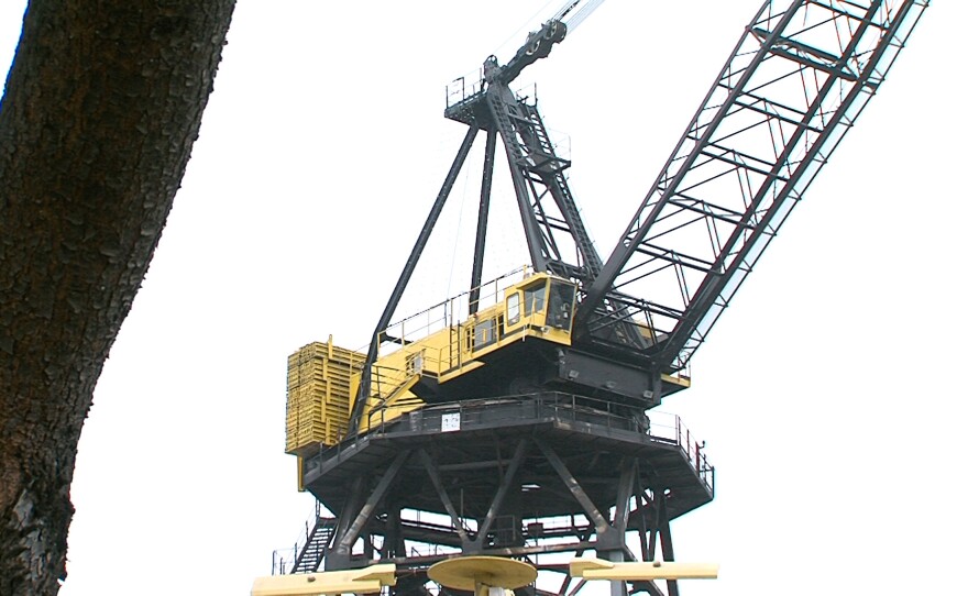 A construction crane overlooks the main headquarters for General Dynamics NASSCO in San Diego.
