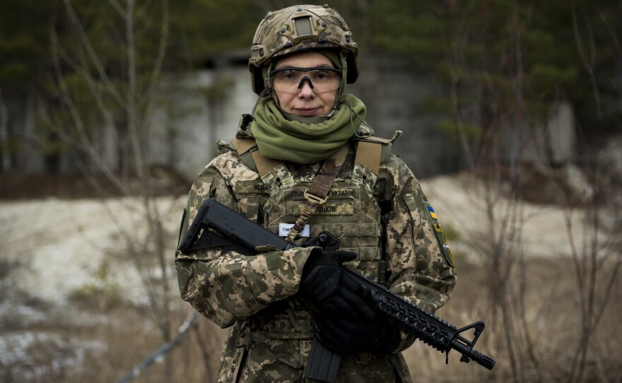 Marta Yuzkiv, a doctor who works in medical trials, poses for a portrait while training. "I would like to say that we are in danger now, and not just danger for Ukraine, but danger for the whole democratic world," she says. "So I hope all together we can stop Putin."