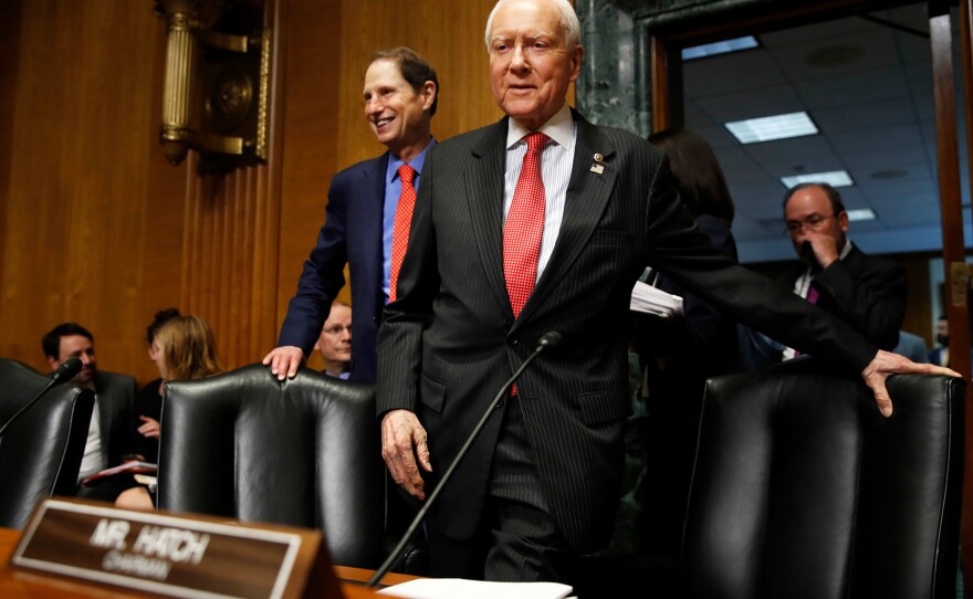 Senate Finance Committee Chairman Orrin Hatch, R-Utah, center, and ranking member Ron Wyden, D-Ore., have a plan to renew funding for the Children's Health Insurance Program, which lapsed Sept. 30.
