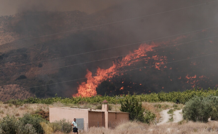 A wildfire rages in Alfajir, near Almeria in southeastern Spain, Friday.
