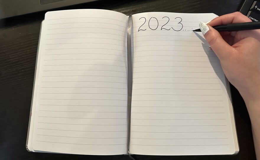 KPBS podcast producer Emilyn Mohebbi is pictured writing down her new year’s goals in San Diego, Jan. 5, 2022.