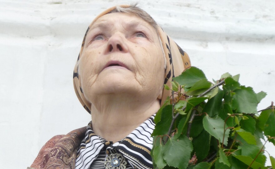 "Mysteries Of The Jesus Prayer" focuses on the ancient and obscure Christian prayer first recited by the Apostles more than 2,000 years ago in the Egyptian desert and still practiced by the faithful today. Pictured, a parishioner holds birch tree leaves for the Feast of the Holy Trinity at the Sergiyev Posad Monastary.