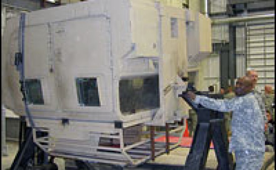 A training simulator at Fort Riley, Kan., helps U.S. troops prepare to experience a Humvee rollover.