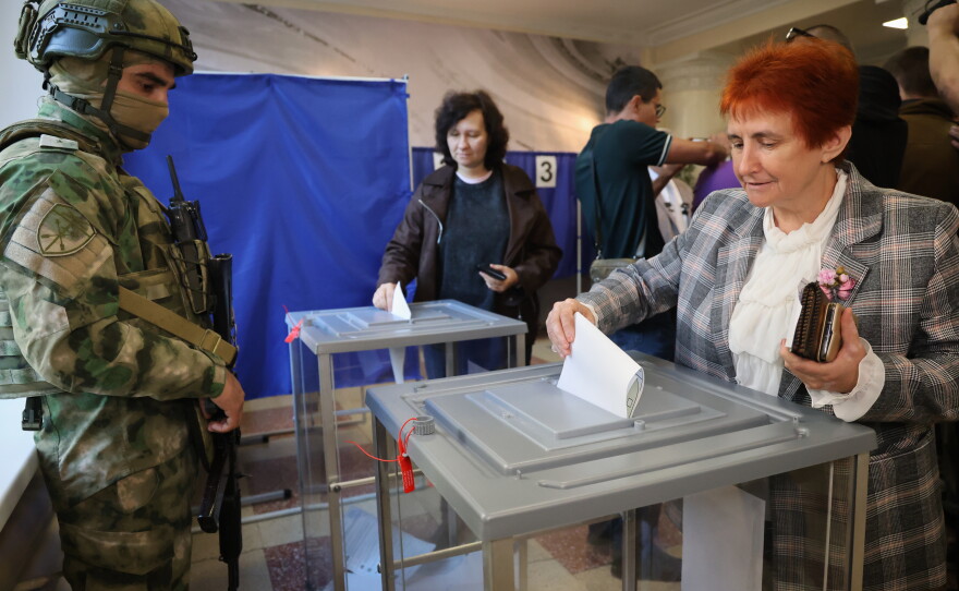 Voters cast ballots at a polling station during Russia's parliamentary election, in the Russian-controlled part of the Donetsk region, Ukraine, Friday, Sept. 18, 2026.