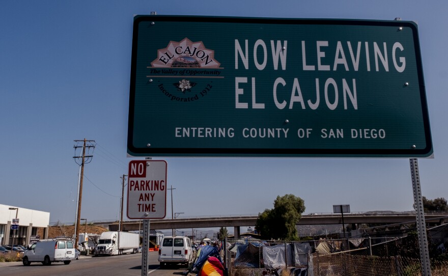 The sign marking the border between El Cajon and unincorporated San Diego County along SR67 is where a homeless encampment has sprung up, April 29, 2022.