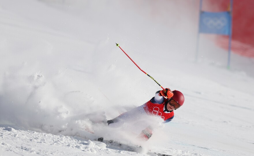 Mikaela Shiffrin falls during the women's giant slalom on day three of the Beijing 2022 Winter Olympic Games.