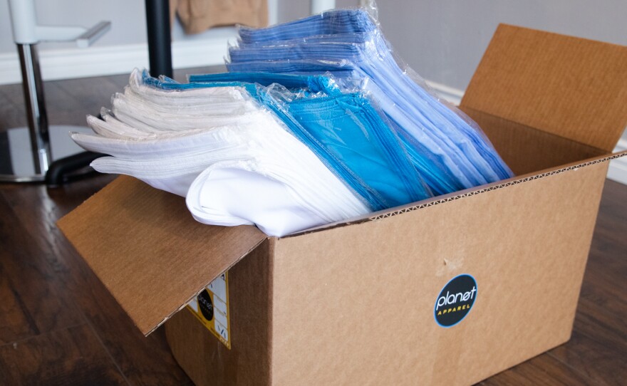 A box of bandanas is shown at the offices of Planet Apparel in San Diego on March 26, 2020. San Diego County purchased bandanas from the company as fears of mask shortages escalated.