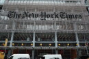 The New York Times says federal agents showed up at several of its journalists' homes Friday night to try to force them to testify before a grand jury next week.
