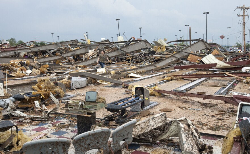 The destruction was wide and devastating in Moore, Okla., on Monday after a tornado roared through.