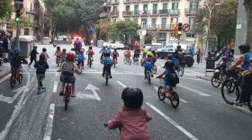 Children joining the <em>bicibus</em> in the Eixample district of Barcelona make their way to school on a recent Friday morning. The community is hoping to build a school-friendly bike lane for a safer commute for kids.