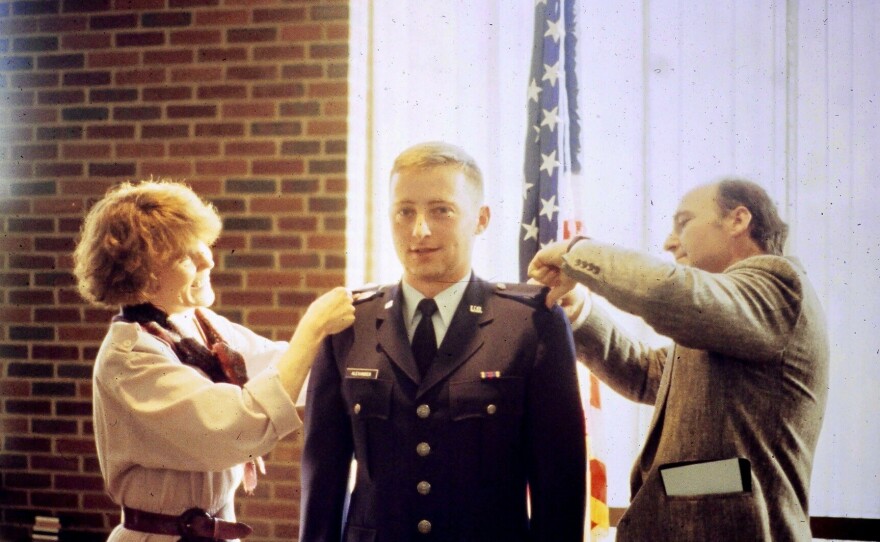 Robert Alexander getting his 2nd lieutenant bars pinned by his parents at his commissioning.