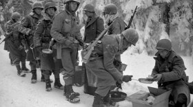 Soldiers in line for food, Belgium, January 1945.