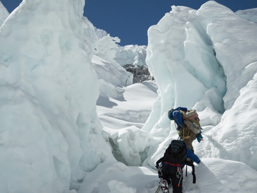 Ice fall doctors climbing snow peaks, Khumbu Ice Fall, Everest.