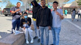 A group of Venezuelan men, including Luis Suárez and Carlos Carrillo Zambrano (pictured in the foreground) at the Paso del Norte International Bridge in Ciudad Juárez, Mexico. They are among many migrants who say that the CBP One app remains riddled with glitches despite a recent update.