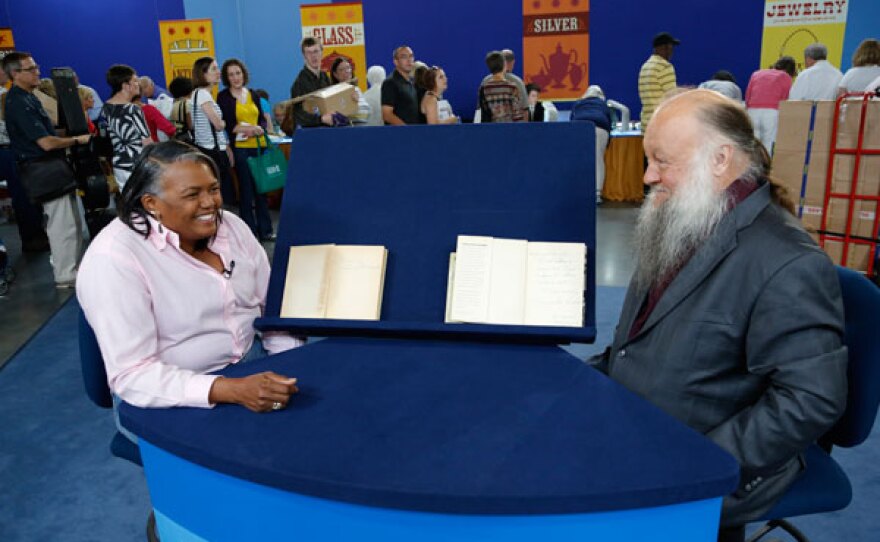 Ken Sanders (right) appraises Langston Hughes signed first edition books for $8,000 to $10,000 in Richmond, Virginia.