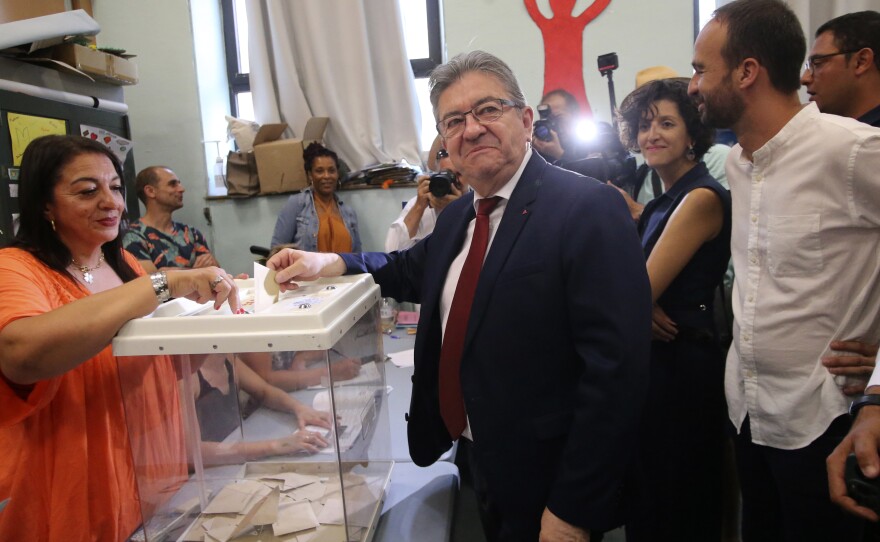 Hard-left leader Jean-Luc Melenchon casts his ballot in a polling station on Sunday in Marseille.