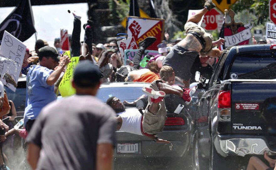 People fly into the air as a vehicle drives into a group of protesters demonstrating against white nationalists in Charlottesville, Va. on Aug. 12, 2017. Kelly won a Pulitzer Prize for the image.