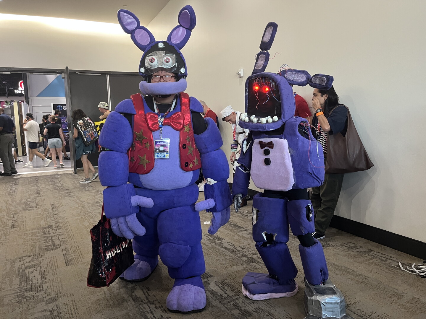 Two cosplayers portray different versions of Bonnie the Rabbit from the horror video game franchise "Five Nights at Freddy's" at Comic-Con on July 23, 2026.