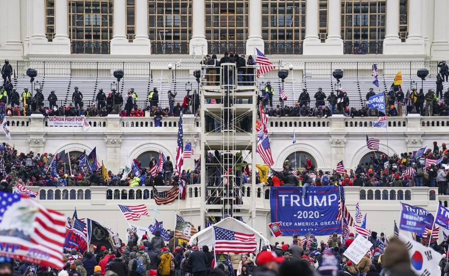 Insurrectionists loyal to former President Donald Trump breach the Capitol in Washington on Jan. 6. Prosecutors secured the first guilty plea in the major case brought against members of the Oath Keepers extremist group in the attack on Wednesday.