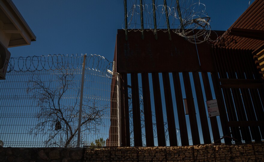 Razor wire sits atop the U.S.-Mexico border fence in Nogales, Ariz., as seen here on March 27.