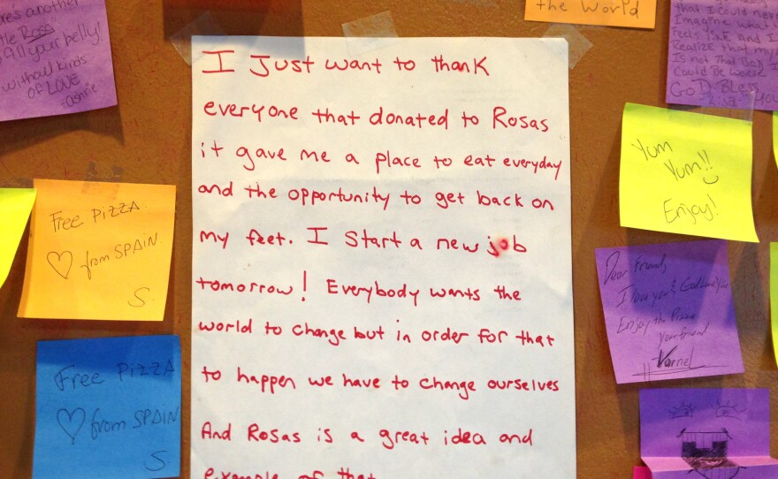 Messages adorn the walls of a Philadelphia pizza shop where customers pay an extra $1 to feed a person who is homeless.