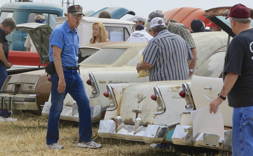 Car buffs look over Chevrolet vehicles during a preview Friday for an auction of vintage cars and trucks from the former Lambrecht Chevrolet dealership in Pierce, Nebraska.