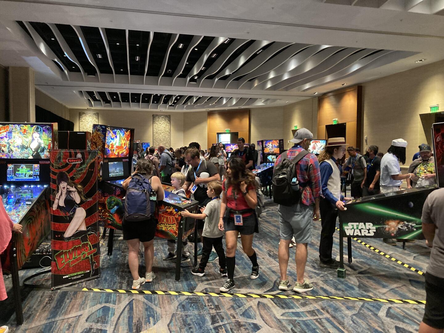 Comic-Con attendees play pinball at the pinball arcade popup at the Marriott Marquis on July 26, 2024.