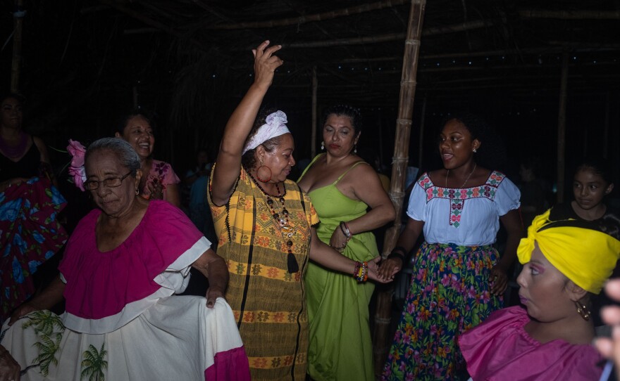 Women at the gathering celebrate with a dance of the devils during at the fisherman's square on July 22.